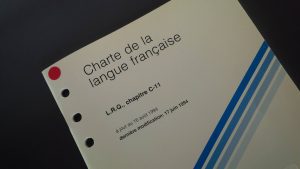 Charte de la langue française, which dictates language requirements for conferences in Quebec